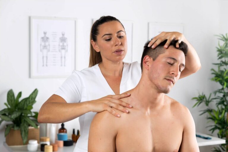 Therapist working on a guest&rsquo;s head, neck and shoulders